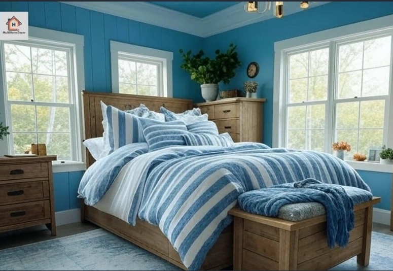 Blue bedroom with striped blue bedding, wooden bed, plants, and large windows with natural light.
