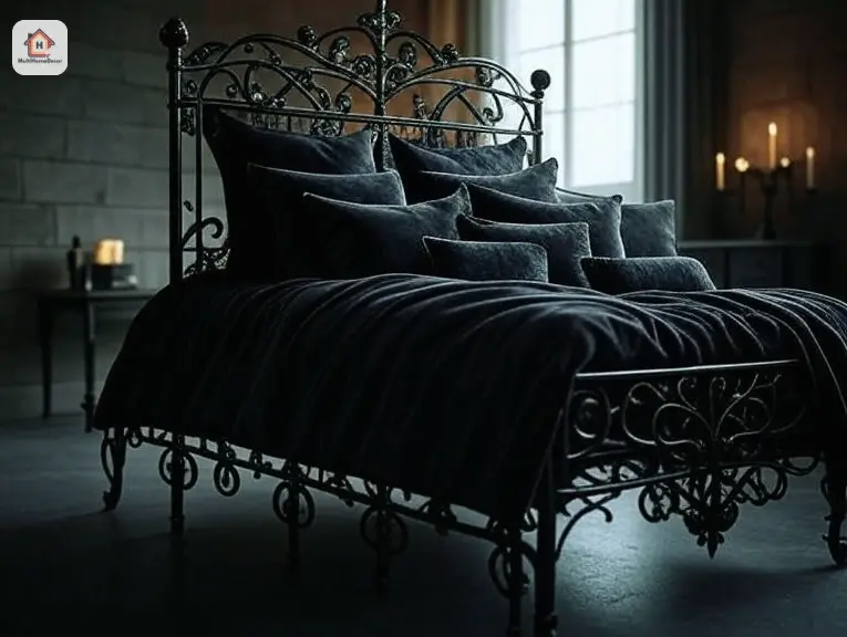 Gothic wrought iron bedframe with dark bedding in a dim room, featuring a candelabra and window