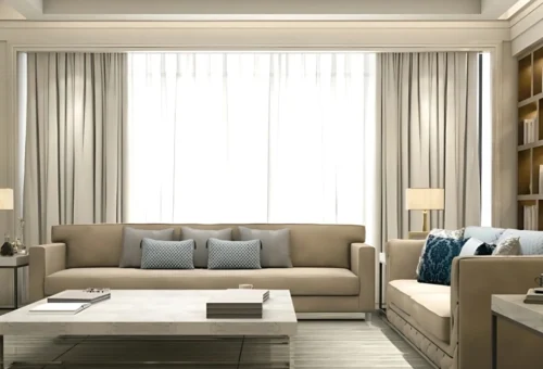 Modern living room decor ideas with neutral-toned sofas, elegant curtains, and cozy lighting.